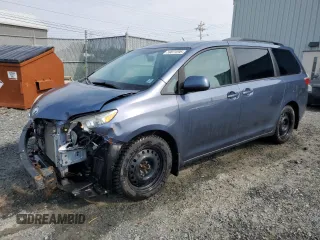 2015 Toyota Sienna LE with VIN 5TDJK3DC0FS111934, listed as a Copart auction lot 59073295 with 134,947 mi miles and Salvage title. Bid and sale history available at DreamBid. Image 1.