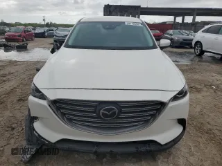 2020 Mazda CX-9 Sport z VIN JM3TCABY6L0413940, wystawiony jako Copart lot #39110534 z przebiegiem 20 881 mil mil oraz . Historia ofert i sprzedaży dostępna na DreamBid. Obrazek 5.