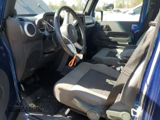 2010 Jeep Wrangler Unlimited Sahara with VIN 1J4BA5H19AL171369, listed as a Copart auction lot 50412855 with 152,742 mi miles and Salvage Title. Bid and sale history available at carsss.com. Image 7.