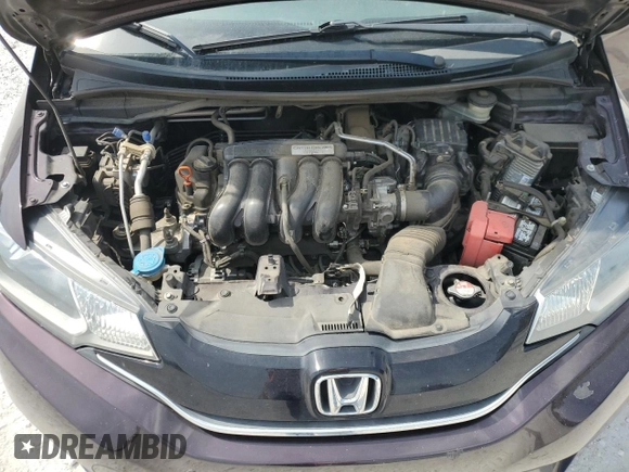2015 Honda Fit EX-L z VIN 3HGGK5H8XFM777535, wystawiony jako Copart lot #59304185 z przebiegiem 106 393 mil mil oraz Szkoda całkowita • Salvage title. Historia ofert i sprzedaży dostępna na DreamBid. Obrazek 11.