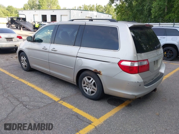 2005 Honda Odyssey EX-L with VIN 5FNRL38715B003399, listed as a IAAI auction lot 42589092 with 252,737 mi miles and . Bid and sale history available at DreamBid. Image 3.