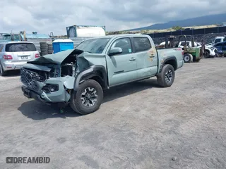 2023 Toyota Tacoma 4WD SR with VIN 3TYCZ5AN7PT145185, listed as a IAAI auction lot 41658297 with 23,647 mi miles. Bid and sale history available at carsss.com. Image 2.