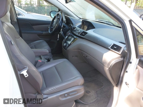 2014 Honda Odyssey EX-L with VIN 5FNRL5H63EB064854, listed as a IAAI auction lot 42102704 with 148,536 mi miles and . Bid and sale history available at carsss.com. Image 5.