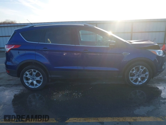 2014 Ford Escape Titanium with VIN 1FMCU9JX4EUD30964, listed as a IAAI auction lot 41772153 with 179,481 mi miles and . Bid and sale history available at DreamBid. Image 13.