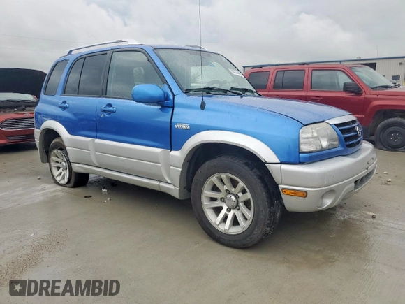 2005 Suzuki Grand Vitara LX with VIN JS3TD62V354200952, listed as a Copart auction lot 60374465 with 134,957 mi miles and Salvage title. Bid and sale history available at DreamBid. Image 4.
