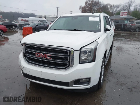 2015 GMC Yukon XL SLT with VIN 1GKS1HKC7FR223513, listed as a IAAI auction lot 40822575 with 128,239 mi miles. Bid and sale history available at carsss.com. Image 2.
