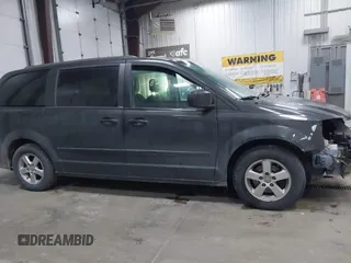 2012 Dodge Grand Caravan SXT with VIN 2C4RDGCG7CR358266, listed as a IAAI auction lot 41582428 with 169,137 mi miles and . Bid and sale history available at DreamBid. Image 13.