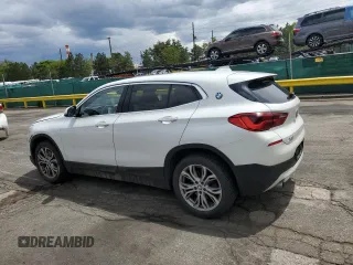 2018 BMW X2 xDrive28i z VIN WBXYJ5C38JEF79686, wystawiony jako Copart lot #56988735 z przebiegiem 103 799 mil mil oraz Szkoda całkowita • Salvage title. Historia ofert i sprzedaży dostępna na DreamBid. Obrazek 2.