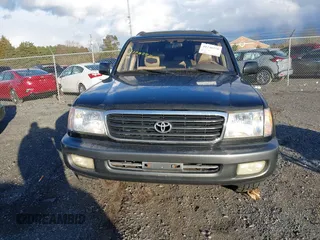 2000 Toyota Land Cruiser with VIN JT3HT05J7Y0110667, listed as a IAAI auction lot 41248220 with 208,043 mi miles. Bid and sale history available at carsss.com. Image 12.