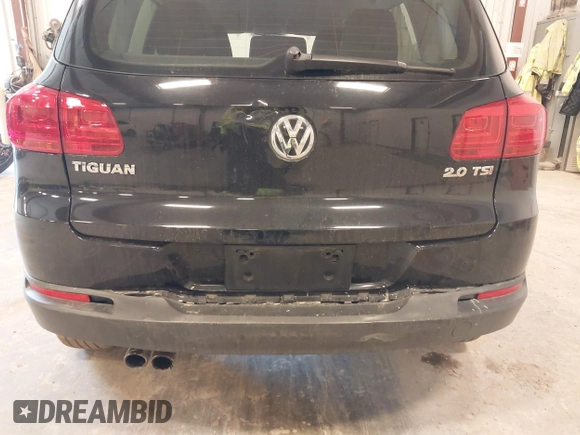 2014 Volkswagen Tiguan SE z VIN WVGAV3AX9EW614094, wystawiony jako IAAI lot #42350601 z przebiegiem 128 996 mil mil oraz . Historia ofert i sprzedaży dostępna na DreamBid. Obrazek 6.
