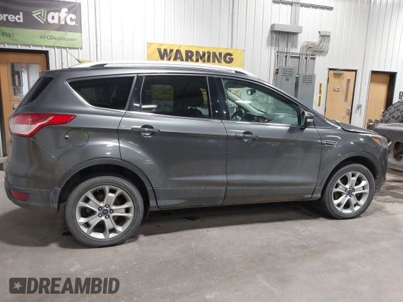 2016 Ford Escape Titanium with VIN 1FMCU9J93GUC39933, listed as a IAAI auction lot 42616323 with 116,482 mi miles and . Bid and sale history available at DreamBid. Image 13.