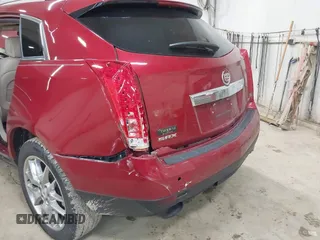 2014 Cadillac SRX Performance Collection z VIN 3GYFNCE30ES596415, wystawiony jako IAAI lot #42329771 z przebiegiem 71 620 mil mil oraz . Historia ofert i sprzedaży dostępna na DreamBid. Obrazek 6.
