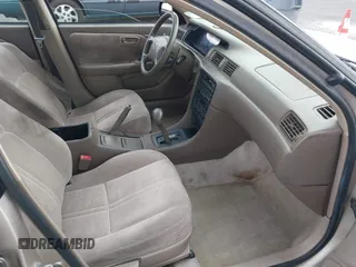 1997 Toyota Camry LE z VIN 4T1BF22K8VU916373, wystawiony jako IAAI lot #41915751 z przebiegiem 259 818 mil mil oraz . Historia ofert i sprzedaży dostępna na DreamBid. Obrazek 5.