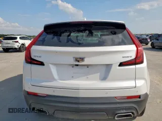 2021 Cadillac XT4 FWD Luxury z VIN 1GYAZAR49MF084676, wystawiony jako Copart lot #59765515 z przebiegiem 32 480 mil mil oraz Czysty tytuł • Clean title. Historia ofert i sprzedaży dostępna na DreamBid. Obrazek 6.