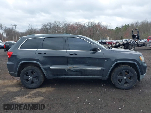 2011 Jeep Grand Cherokee Laredo with VIN 1J4RR4GGXBC597743, listed as a IAAI auction lot 41897286 with 253,111 mi miles and . Bid and sale history available at DreamBid. Image 13.