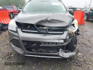 2013 Ford Escape SEL with VIN 1FMCU9HX4DUC75565, listed as a IAAI auction lot 42574351 with 180,876 mi miles and . Bid and sale history available at DreamBid. Image 6.