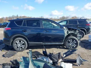 2018 Toyota RAV4 LE with VIN JTMBFREV1JJ743018, listed as a IAAI auction lot 41974309 with 59,135 mi miles. Bid and sale history available at carsss.com. Image 14.