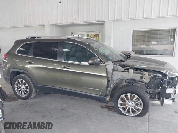 2021 Jeep Cherokee Altitude with VIN 1C4PJLLB5MD203569, listed as a IAAI auction lot 42559737 with 53,961 mi miles and . Bid and sale history available at DreamBid. Image 14.