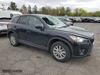 2015 Mazda CX-5 Touring with VIN JM3KE4CY3F0475757, listed as a Copart auction lot 53477875 with 104,546 mi miles and Salvage Title. Bid and sale history available at carsss.com. Image 4.