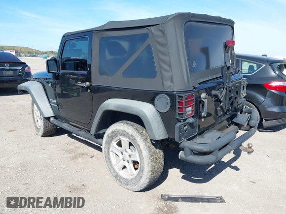 2016 Jeep Wrangler Willys Wheeler z VIN 1C4AJWAG9GL257621, wystawiony jako IAAI lot #41432306 z przebiegiem 84 248 mil mil oraz . Historia ofert i sprzedaży dostępna na DreamBid. Obrazek 3.