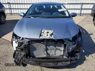 2025 Toyota Corolla Hybrid LE with VIN JTDBDMHE6SJ012428, listed as a Copart auction lot 50814965 with 4,330 mi miles and Salvage Title. Bid and sale history available at carsss.com. Image 5.