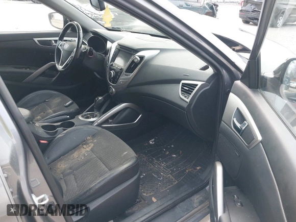 2014 Hyundai Veloster with VIN KMHTC6AD5EU183478, listed as a IAAI auction lot 42107170 with 64,905 mi miles. Bid and sale history available at carsss.com. Image 5.