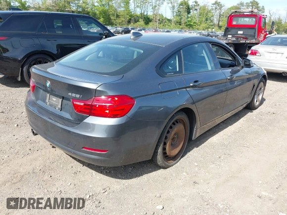 2015 BMW 4 Series 428i xDrive with VIN WBA4C9C55FD331921, listed as a IAAI auction lot 42214901 with 94,970 mi miles and . Bid and sale history available at DreamBid. Image 4.