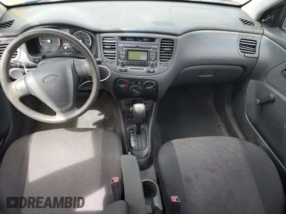 2009 Kia Rio LX with VIN KNADE223696530633, listed as a Copart auction lot 68371794 with 165,505 mi miles and Salvage Title. Bid and sale history available at DreamBid. Image 8.