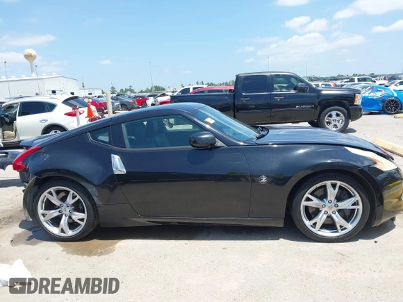 2012 Nissan 370Z z VIN JN1AZ4EH1CM564630, wystawiony jako IAAI lot #42177880 z przebiegiem 173 751 mil mil oraz . Historia ofert i sprzedaży dostępna na DreamBid. Obrazek 14.