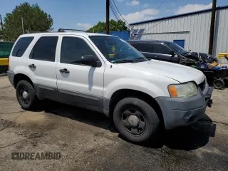 2004 Ford Escape XLS with VIN 1FMCU92114DA15564, listed as a Copart auction lot 59358015 with 186,135 mi miles and Salvage title. Bid and sale history available at DreamBid. Image 4.