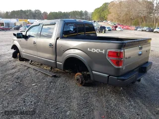 2014 Ford F-150 XL with VIN 1FTFW1ETXEFC17464, listed as a IAAI auction lot 41014879 with 150,129 mi miles. Bid and sale history available at carsss.com. Image 3.
