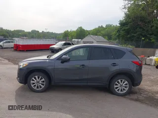 2014 Mazda CX-5 Touring z VIN JM3KE4CY2E0348500, wystawiony jako IAAI lot #42318155 z przebiegiem 182 616 mil mil oraz . Historia ofert i sprzedaży dostępna na DreamBid. Obrazek 14.