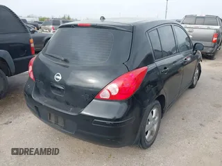 2009 Nissan Versa 1.8 SL with VIN 3N1BC13E59L496882, listed as a IAAI auction lot 41798734 with 210,907 mi miles. Bid and sale history available at carsss.com. Image 4.