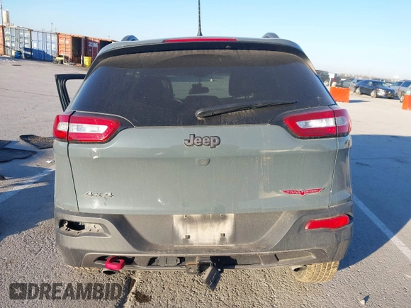 2015 Jeep Cherokee Trailhawk with VIN 1C4PJMBSXFW614416, listed as a IAAI auction lot 41033241 with 112,015 mi miles. Bid and sale history available at carsss.com. Image 17.