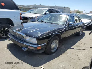 1990 Jaguar XJ with VIN SAJKY1745LC622713, listed as a Copart auction lot 56545414 with Not Provided miles and Salvage Title. Bid and sale history available at DreamBid. Image 1.
