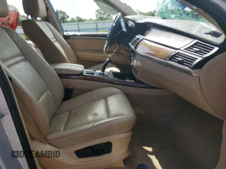 2012 BMW X5 35d with VIN 5UXZW0C51CL668064, listed as a Copart auction lot 62217845 with 140,544 mi miles and Salvage title. Bid and sale history available at DreamBid. Image 7.