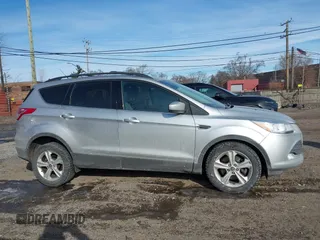 2013 Ford Escape SE with VIN 1FMCU9G98DUD51808, listed as a IAAI auction lot 41527022 with 141,471 mi miles. Bid and sale history available at carsss.com. Image 13.