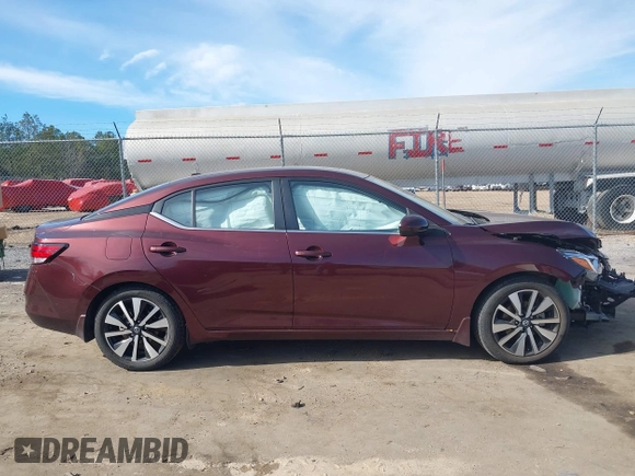 2022 Nissan Sentra SV z VIN 3N1AB8CV5NY221159, wystawiony jako IAAI lot #41322470 z przebiegiem 27 098 mil mil oraz . Historia ofert i sprzedaży dostępna na DreamBid. Obrazek 14.