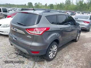 2013 Ford Escape SEL with VIN 1FMCU0HX4DUC83404, listed as a IAAI auction lot 41285095 with 199,024 mi miles. Bid and sale history available at carsss.com. Image 4.