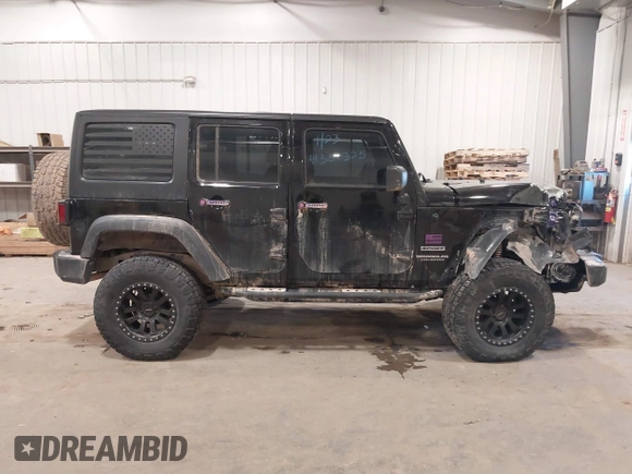2017 Jeep Wrangler Unlimited Sport with VIN 1C4BJWDGXHL698014, listed as a IAAI auction lot 41384325 with 121,402 mi miles. Bid and sale history available at carsss.com. Image 14.