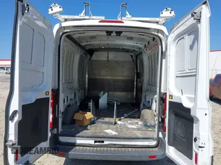 2015 Ford Transit Cargo z VIN 1FTNE2CM6FKA08103, wystawiony jako IAAI lot #42137844 z przebiegiem 224 687 mil mil oraz . Historia ofert i sprzedaży dostępna na DreamBid. Obrazek 8.