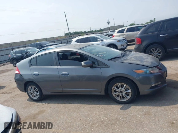 2010 Honda Insight EX with VIN JHMZE2H71AS043465, listed as a IAAI auction lot 42312556 with 151,009 mi miles and . Bid and sale history available at DreamBid. Image 13.