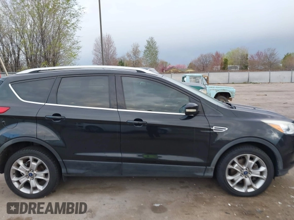 2015 Ford Escape Titanium with VIN 1FMCU9J96FUA27221, listed as a IAAI auction lot 41925276 with 180,758 mi miles and . Bid and sale history available at carsss.com. Image 13.