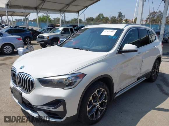2021 BMW X1 sDrive28i z VIN WBXJG7C01M3M73496, wystawiony jako IAAI lot #42132005 z przebiegiem 23 278 mil mil oraz . Historia ofert i sprzedaży dostępna na DreamBid. Obrazek 17.