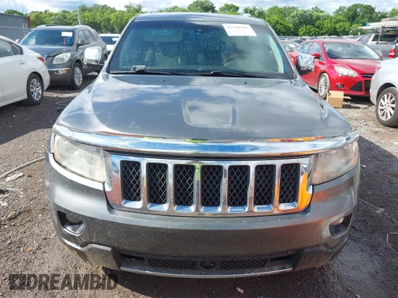 2011 Jeep Grand Cherokee Overland Summit with VIN 1J4RR6GT3BC713812, listed as a IAAI auction lot 42398585 with 208,476 mi miles and . Bid and sale history available at DreamBid. Image 12.