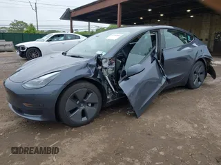 2023 Tesla Model 3 with VIN 5YJ3E1EA9PF673399, listed as a IAAI auction lot 42392643 with 7,571 mi miles and . Bid and sale history available at DreamBid. Image 18.
