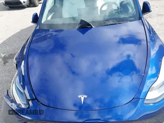 2025 Tesla Model Y Long Range z VIN 7SAYGDED0SF256650, wystawiony jako IAAI lot #41993206 z przebiegiem Nie podano mil oraz . Historia ofert i sprzedaży dostępna na DreamBid. Obrazek 10.