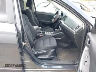 2016 Mazda CX-5 Touring with VIN JM3KE2CYXG0647921, listed as a IAAI auction lot 41948068 with 133,733 mi miles and . Bid and sale history available at DreamBid. Image 5.