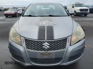 2011 Suzuki Kizashi SE z VIN JS2RE9A3XB6111196, wystawiony jako Copart lot #48076635 z przebiegiem 113 569 mil mil oraz Szkody całkowita. Historia ofert i sprzedaży dostępna na DreamBid. Obrazek 5.