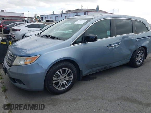 2012 Honda Odyssey EX-L with VIN 5FNRL5H60CB095086, listed as a IAAI auction lot 42251330 with 144,232 mi miles and . Bid and sale history available at DreamBid. Image 17.